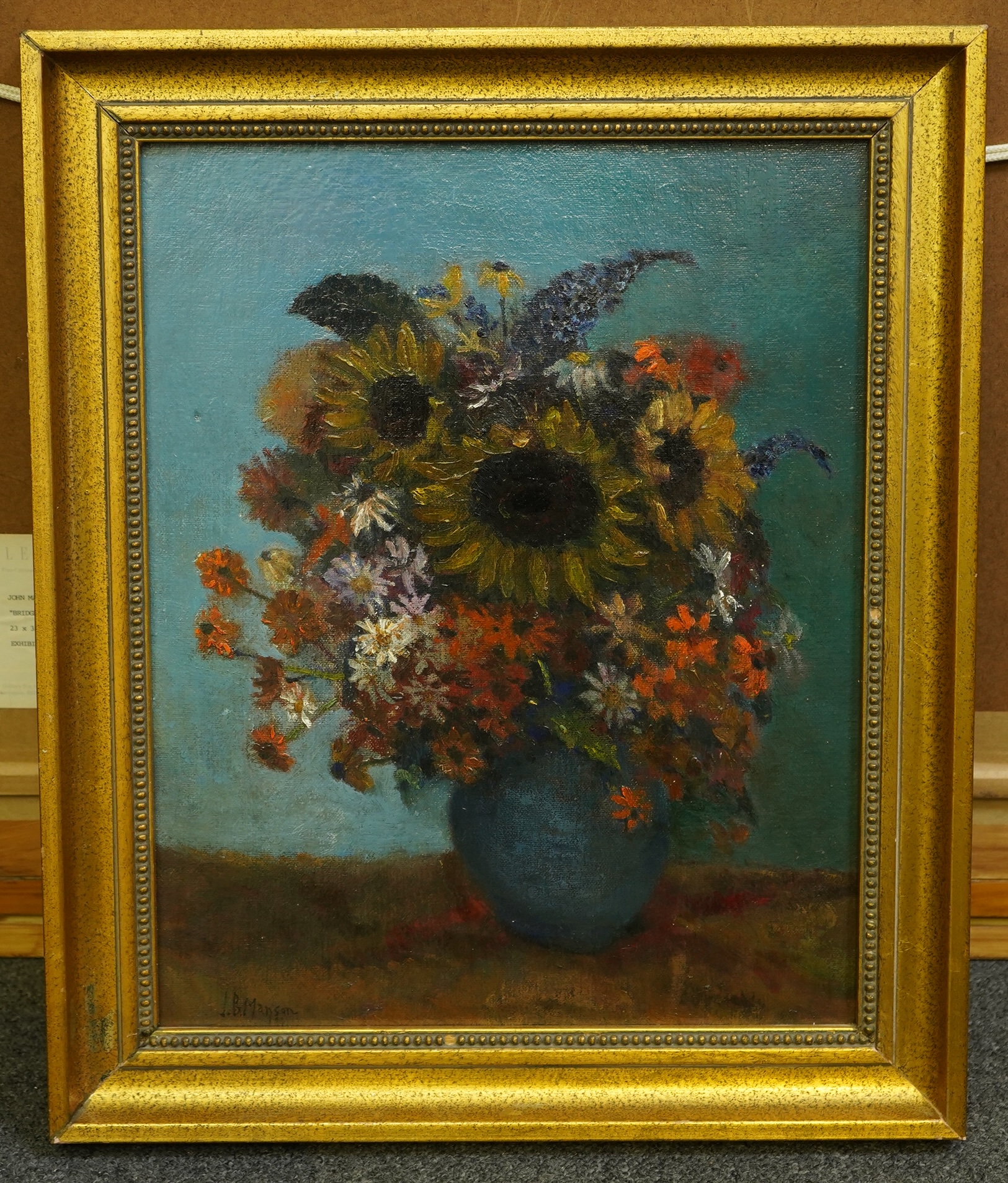 James Bolivar Manson (English, 1879-1945), Still life of sunflowers and other blooms in a blue vase, oil on board, 43 x 34cm